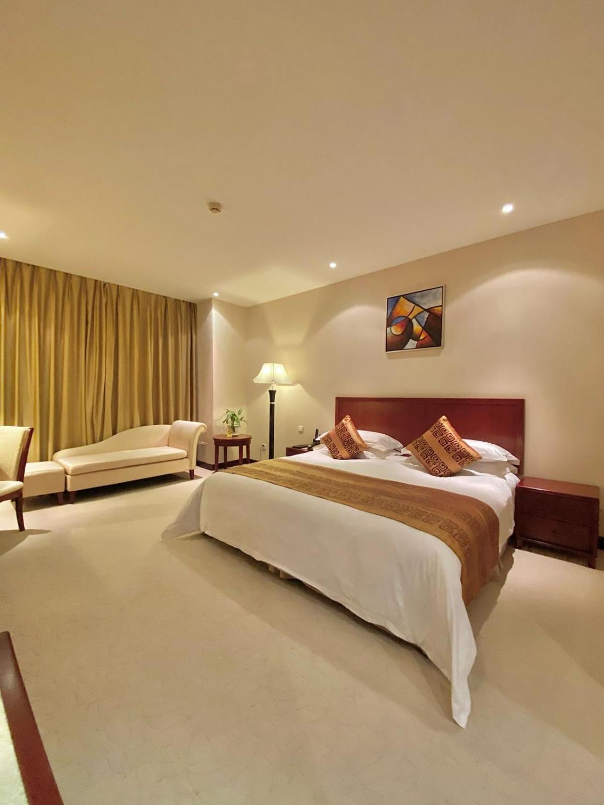 فندق بكين بلاس سولوكسي أستانا المظهر الخارجي الصورة A bedroom at the hotel